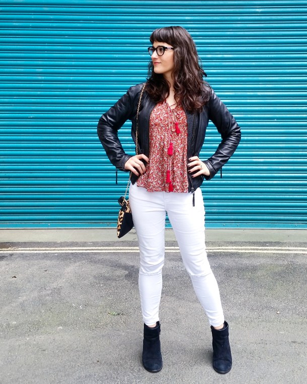 Call Me Katie - wearing white jeans, black leather jacket, heeled boots and red pompom tunic for weekend look 2